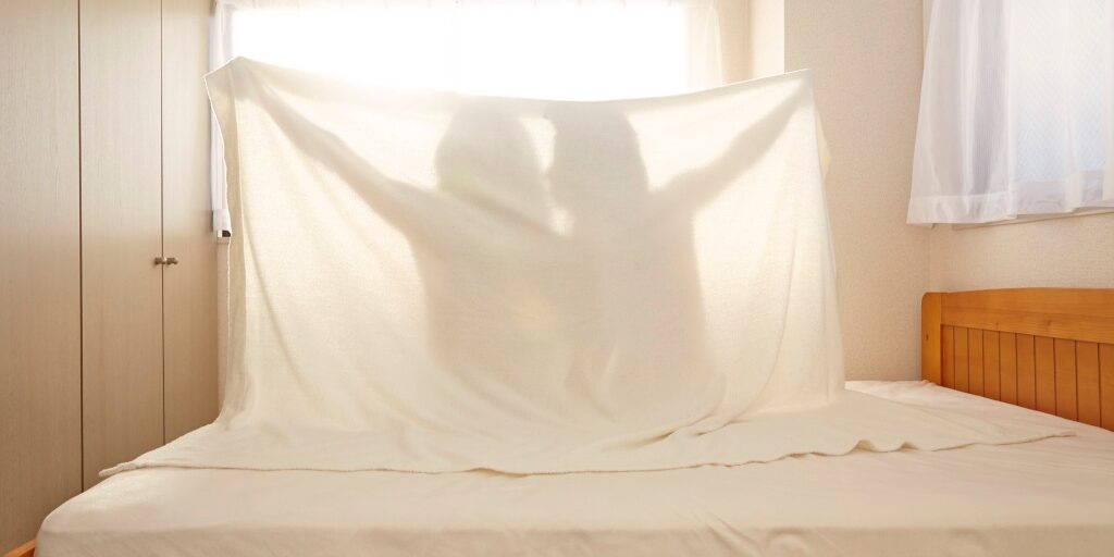 Couple sitting in bed.